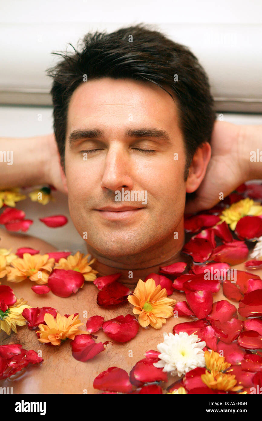 Man enjoying holidays in flower bath Stock Photo