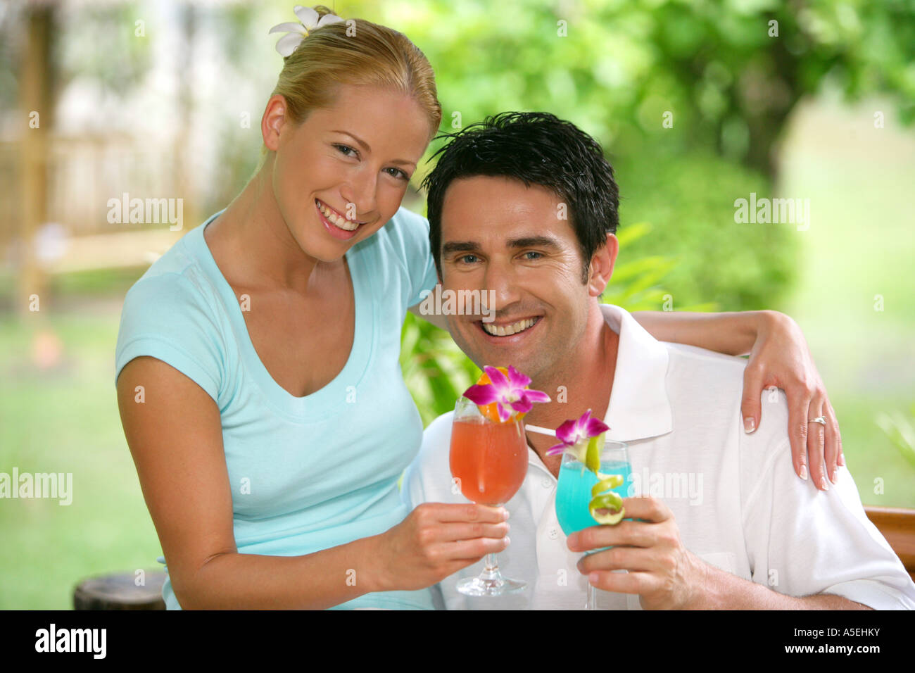 couple in love enjoy some drinks on holidays in Thailand Stock Photo