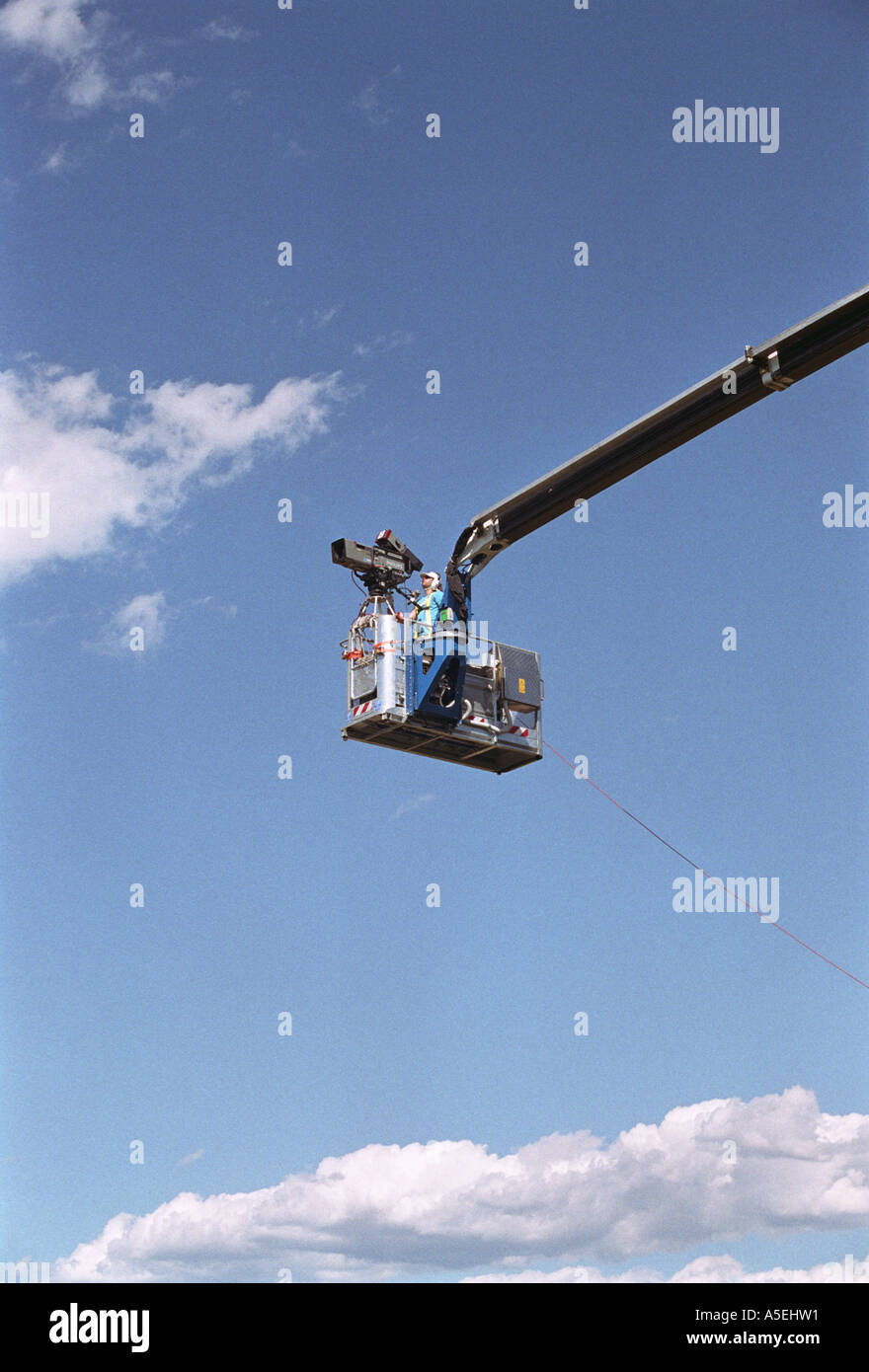 tv camera on crane boom Stock Photo - Alamy