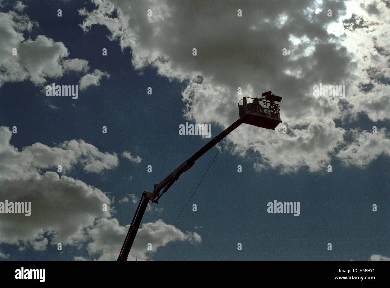 tv camera on crane boom Stock Photo