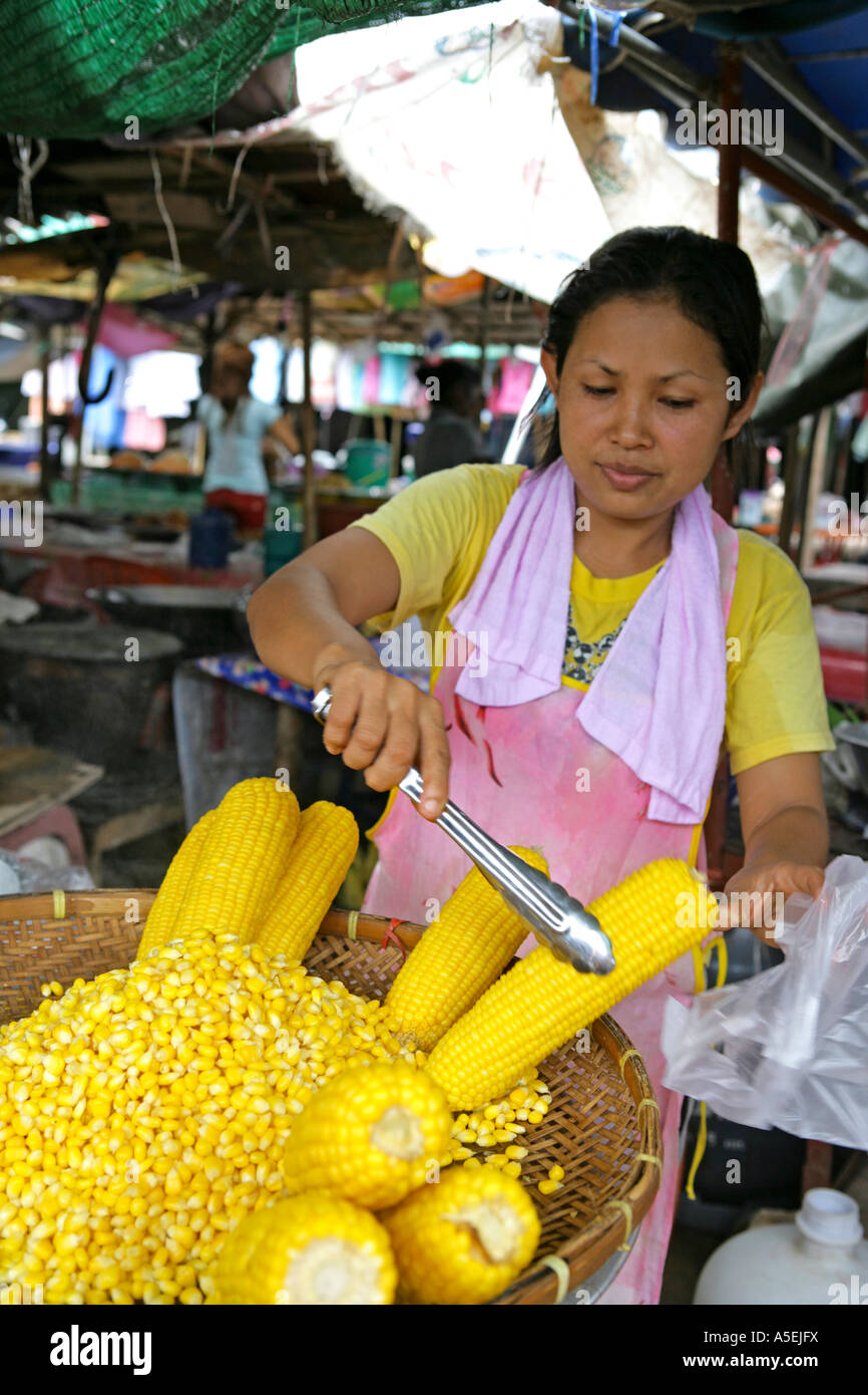 woman sales maize on market in Thailand Stock Photo