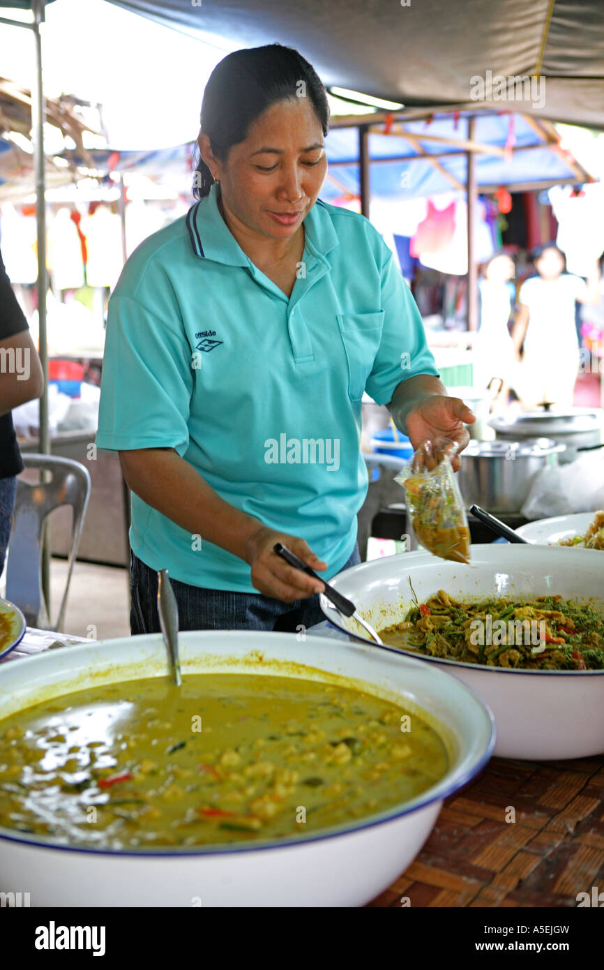 woman sales thai food on market in Thailand Stock Photo