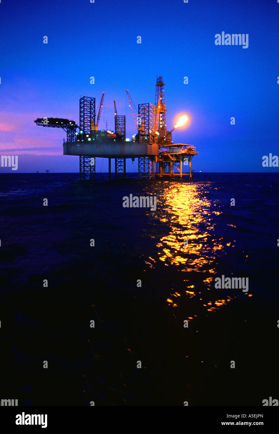 Flare testing a new well during completion work on a shallow water jackup rig in the Gulf of Mexico. Stock Photo