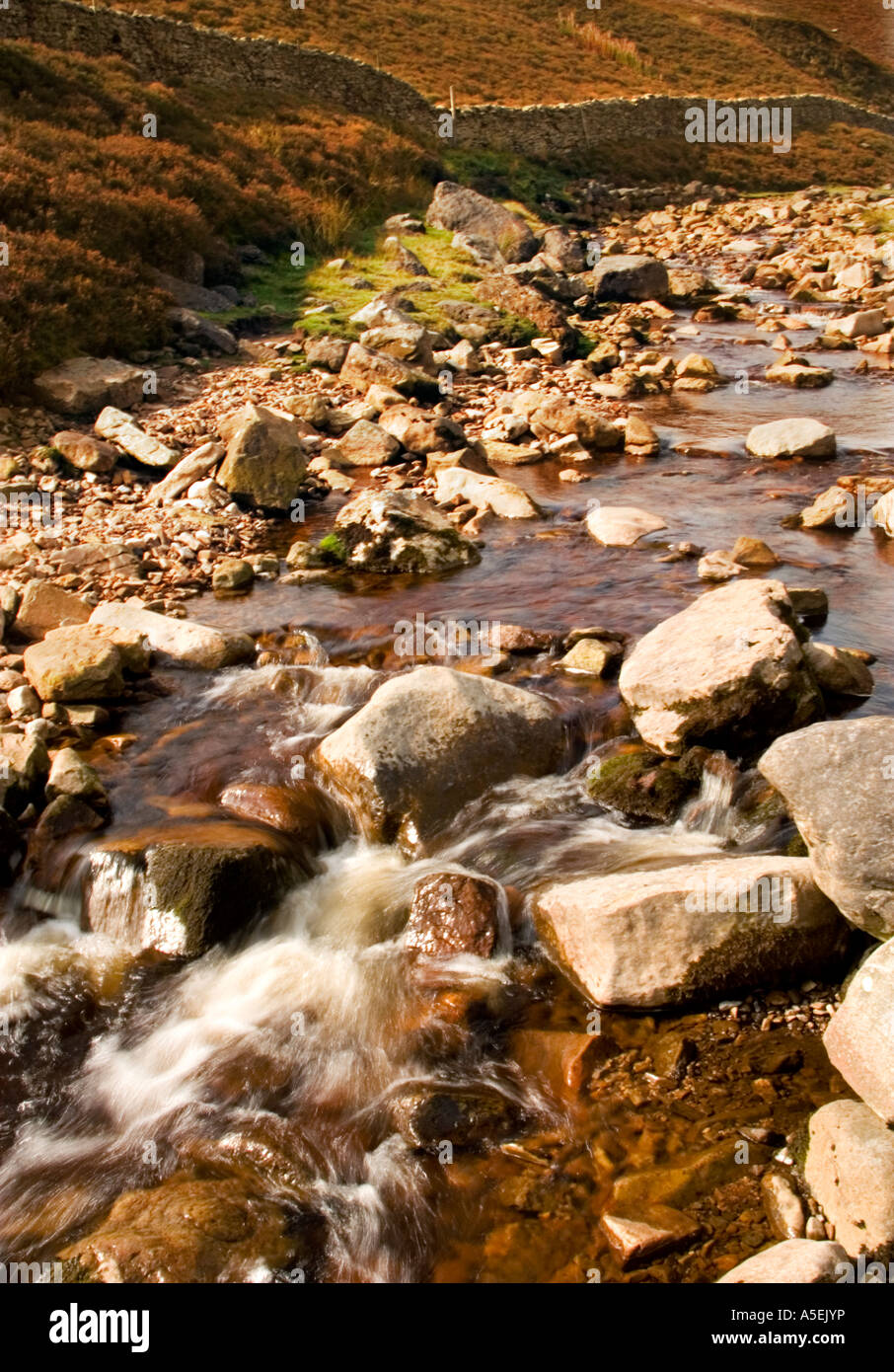 A craggy river tumbles down over rocks and stones in the Yorkshire ...