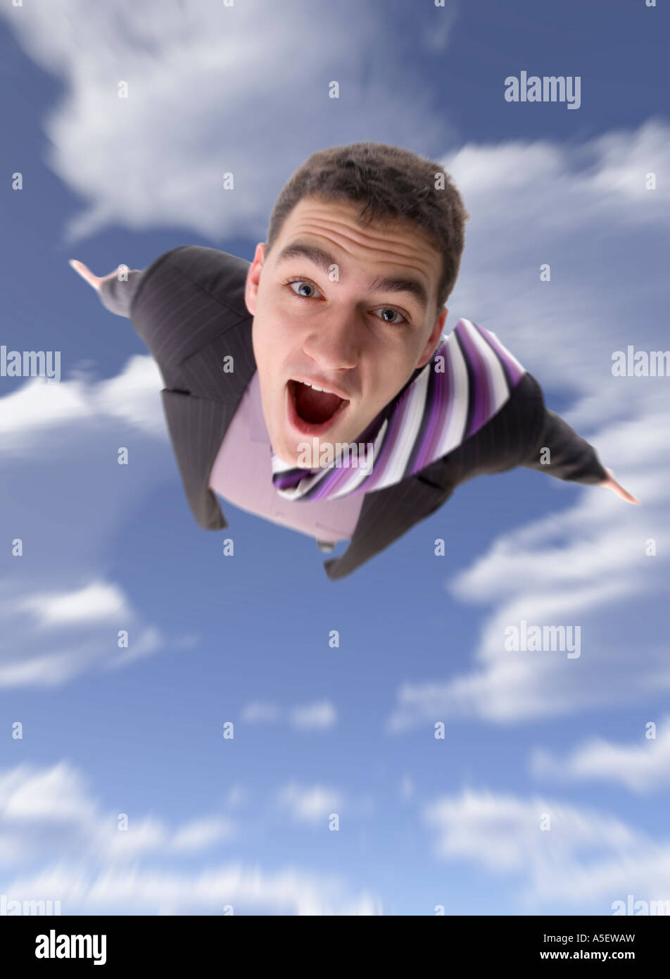 Man s body moving toward on the blue cloudy sky Focus on the eyes the rest blured Stock Photo