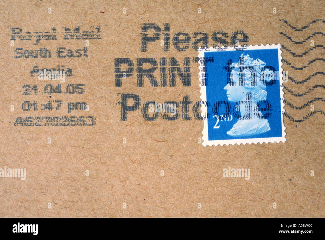 UK postage stamp on brown envelope Stock Photo