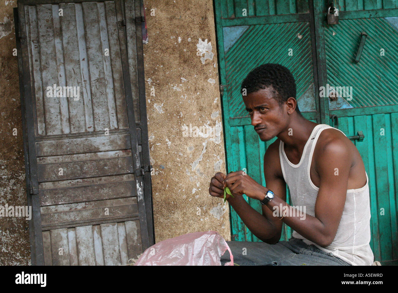 Harar, Ethiopia, young man chewing Qat leaves Stock Photo