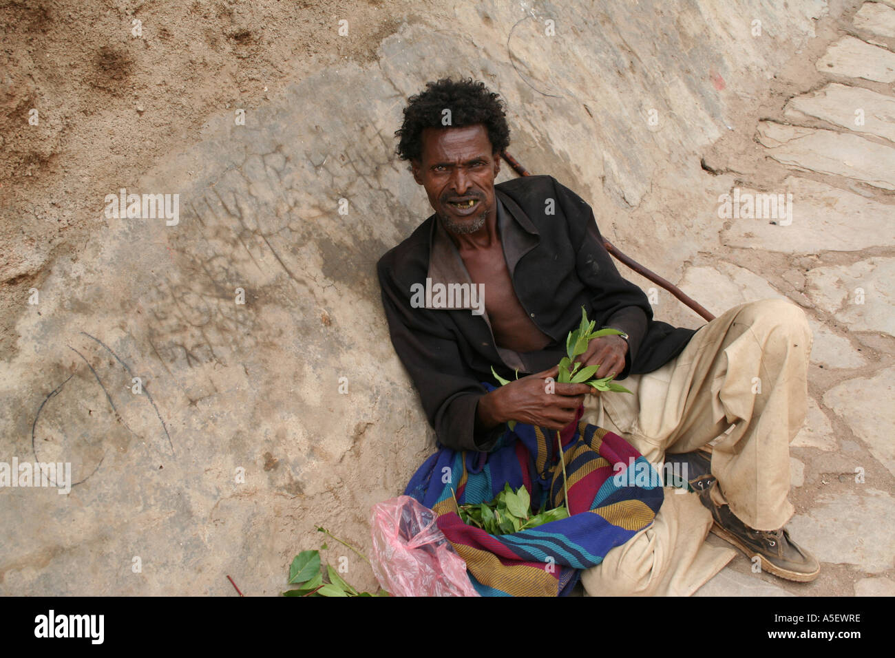 Harar, Ethiopia, homless man chewing Qat leaves on the street Stock Photo