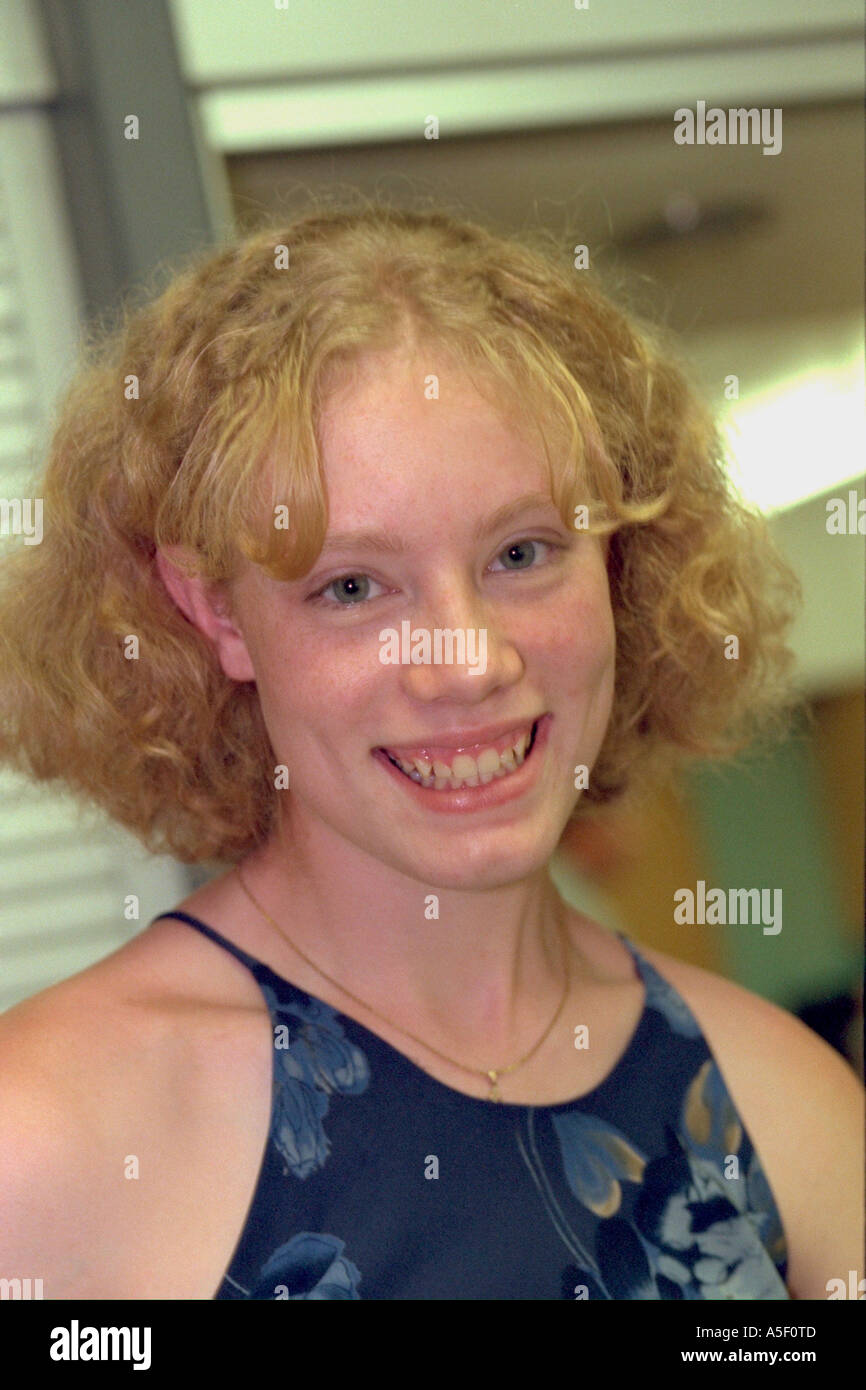 Teen girl age 15 warmly smiling at family reunion. Redwood Falls Minnesota USA Stock Photo