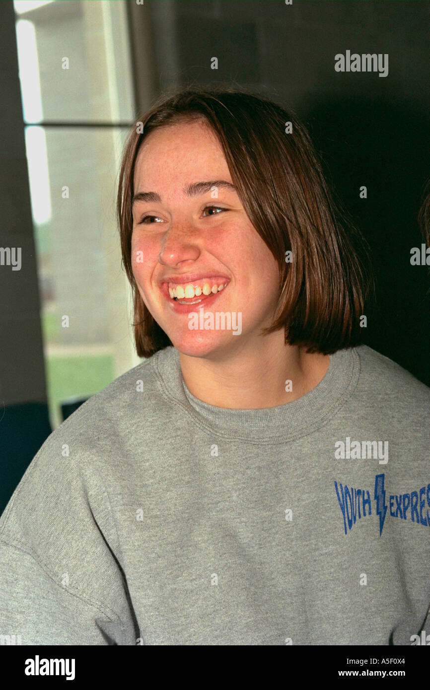 Happy girl age 15 smiling at community youth center retreat. Camp Ripley Minnesota USA Stock Photo