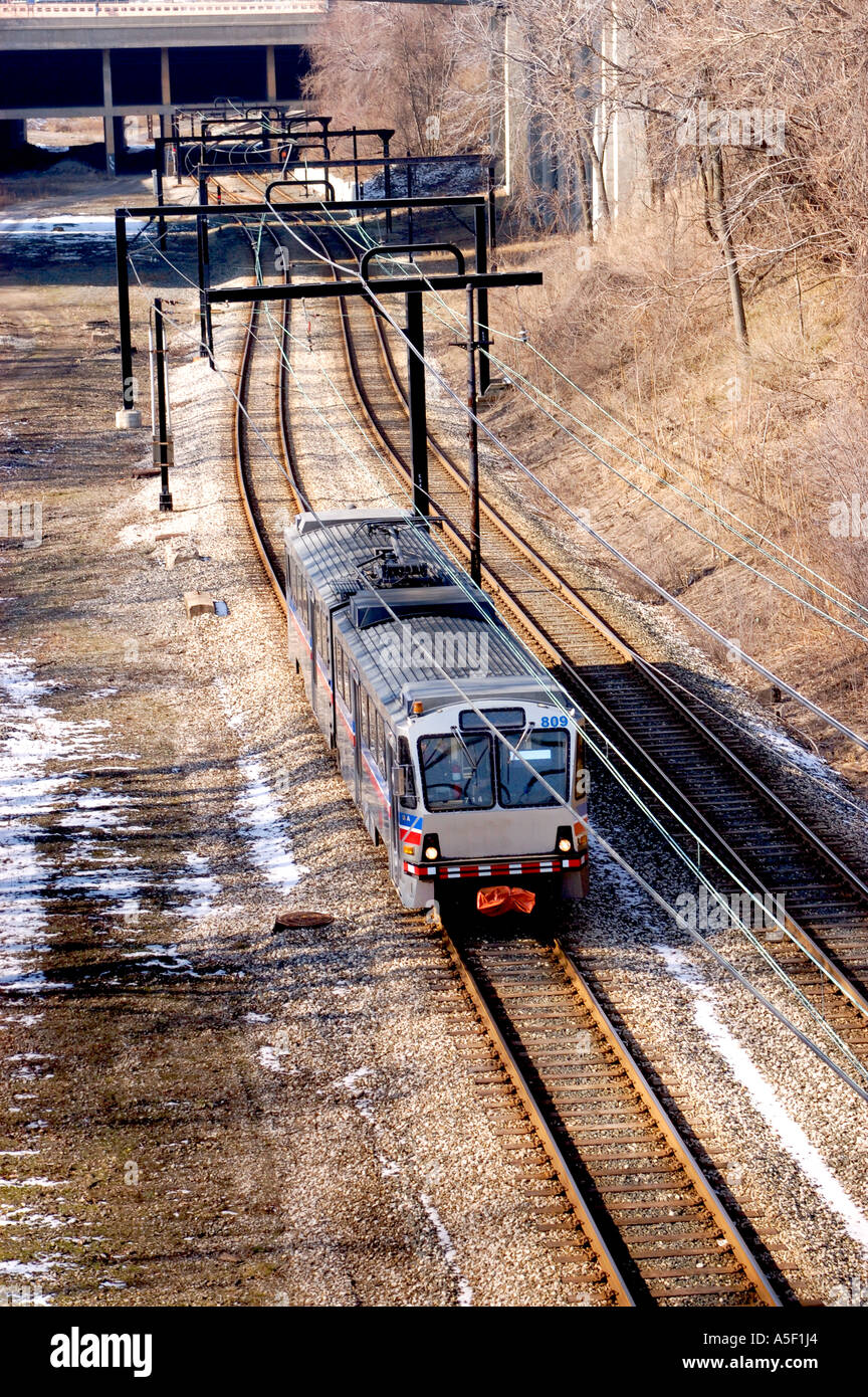 city rapid transit electric train coming toward camera viewed from above Stock Photo