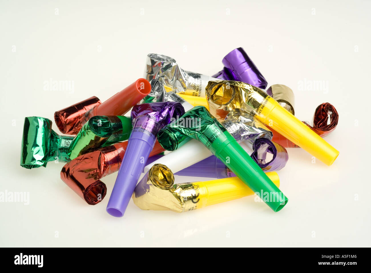 Colourful party poppers and whistles Stock Photo