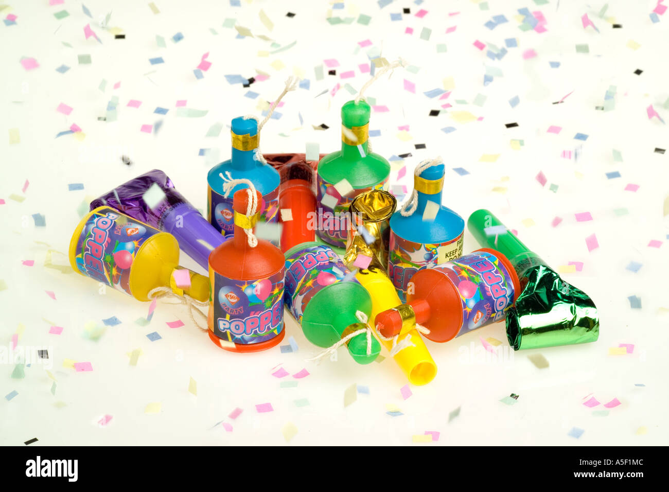 Colourful party poppers and whistles and confetti Stock Photo
