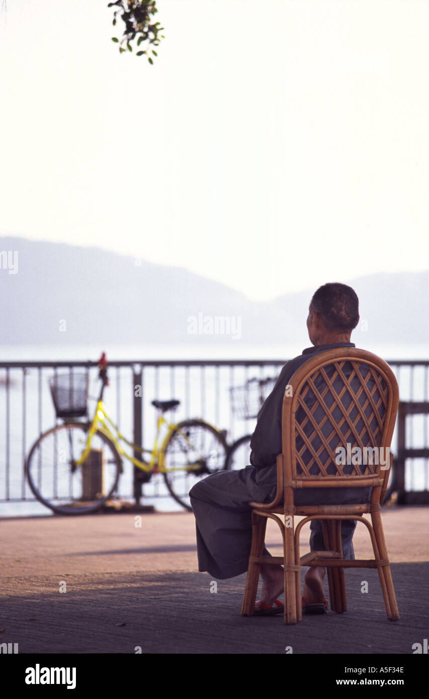 Lonely man sits on old hi-res stock photography and images - Alamy
