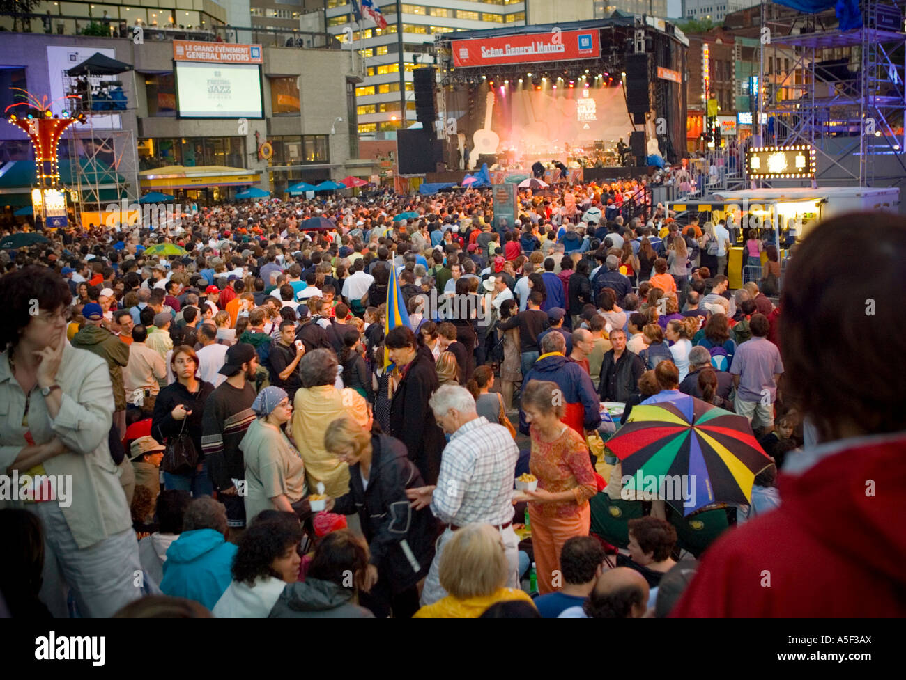 Crowds attending an evening performance at an outdoor music festival in Montreal. Stock Photo