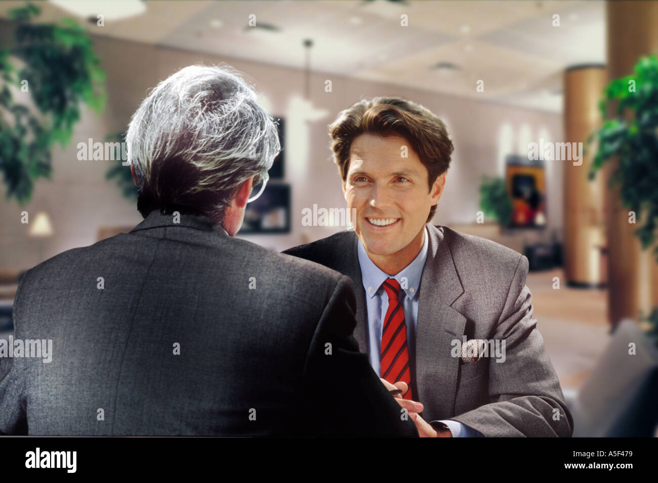 businessmen in conversation Stock Photo