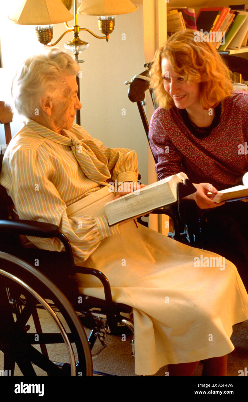 Minister age 36 discussing the bible with elder age 87. Western Springs Illinois USA Stock Photo