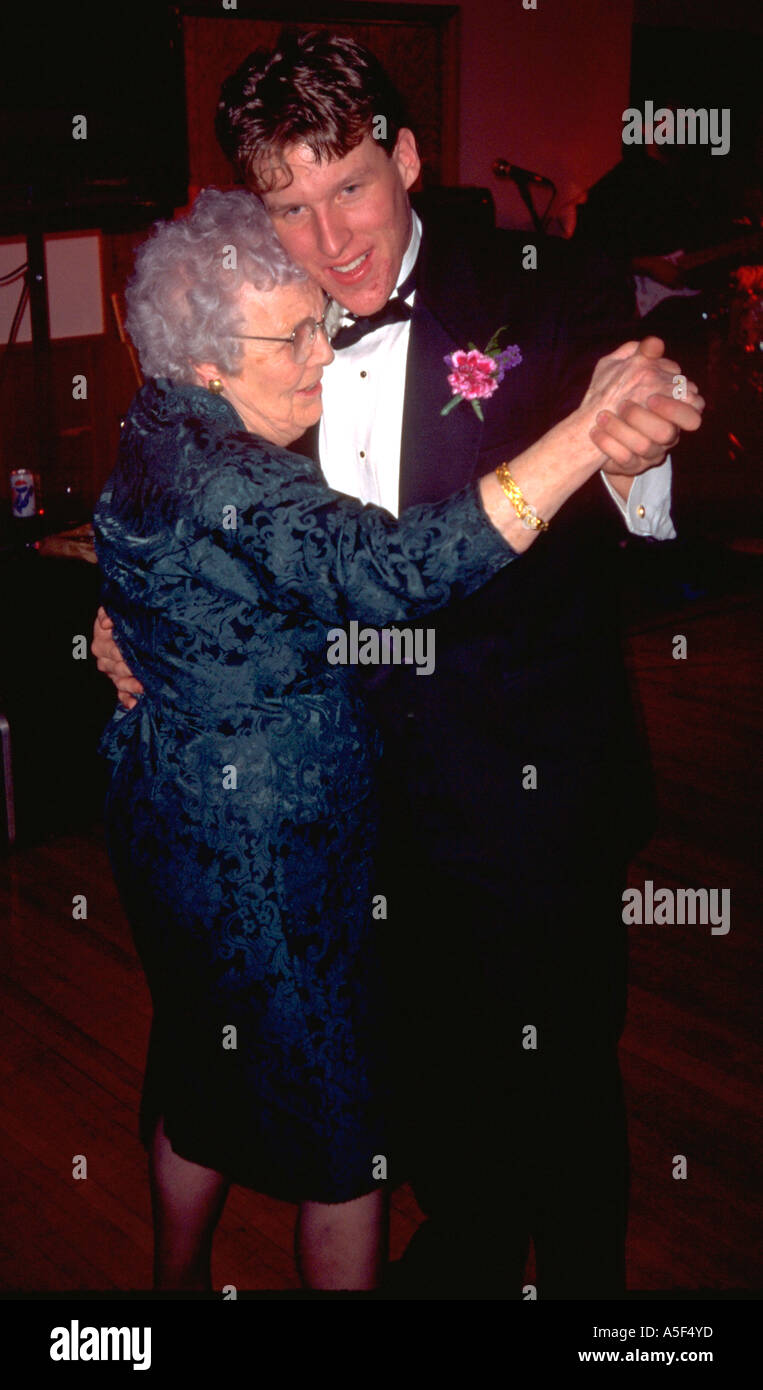 Groom dancing with grandma at wedding age 25 and 82 St Peter Minnesota USA Stock Photo
