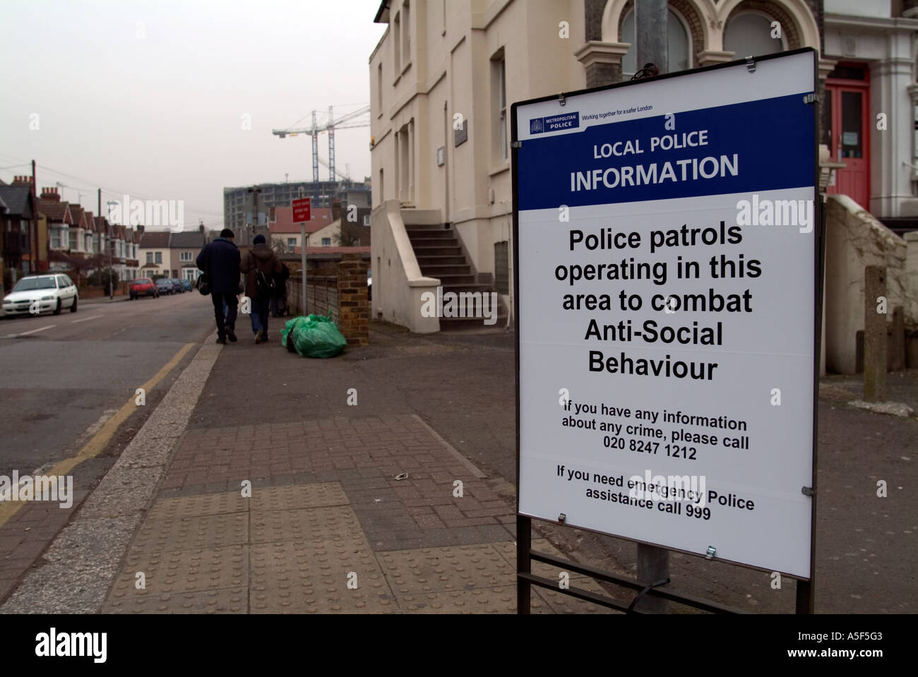 Metropolitan police sign warning of police presence in area to combat anti social behaviour Hounslow, Middlesex, west London, UK. Stock Photo