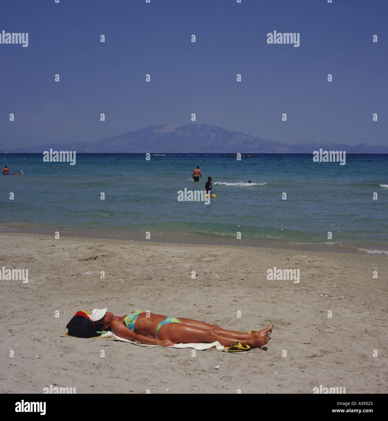 Young woman in patterned bikini at Alikes Beach east coast of Zakynthos
