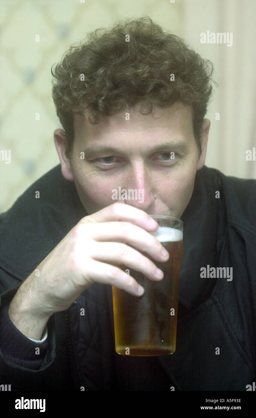 Cricket star Mike Atherton drinking a pint of beer Stock Photo Alamy