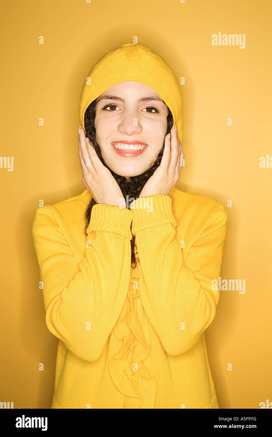 Young woman wearing yellow raincoat hi-res stock photography and images ...