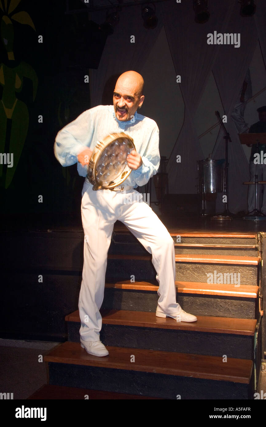 A man plays the tambourine at a in Sao Paulo Brazil Stock