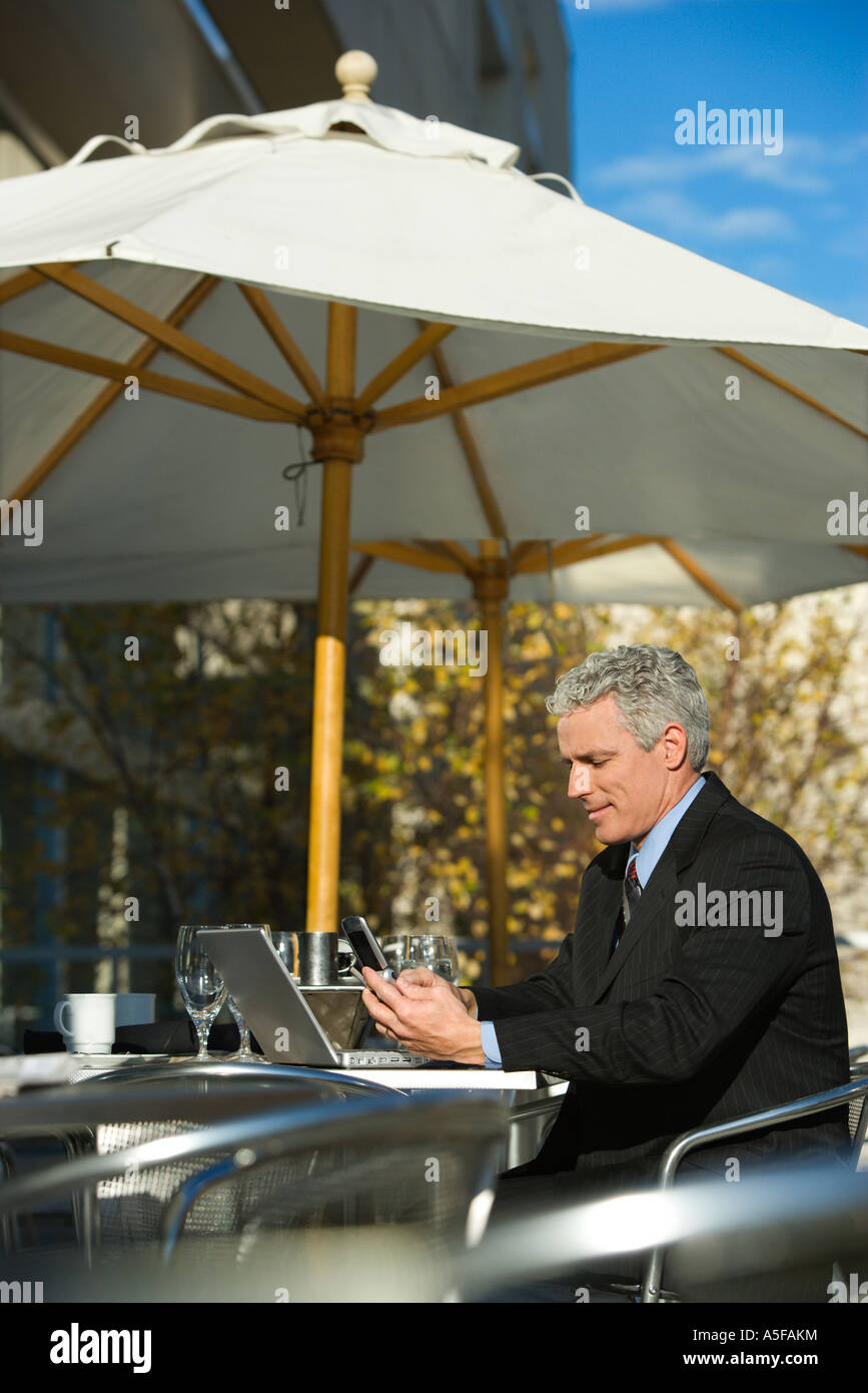 Man computer outside umbrella hi-res stock photography and images - Alamy