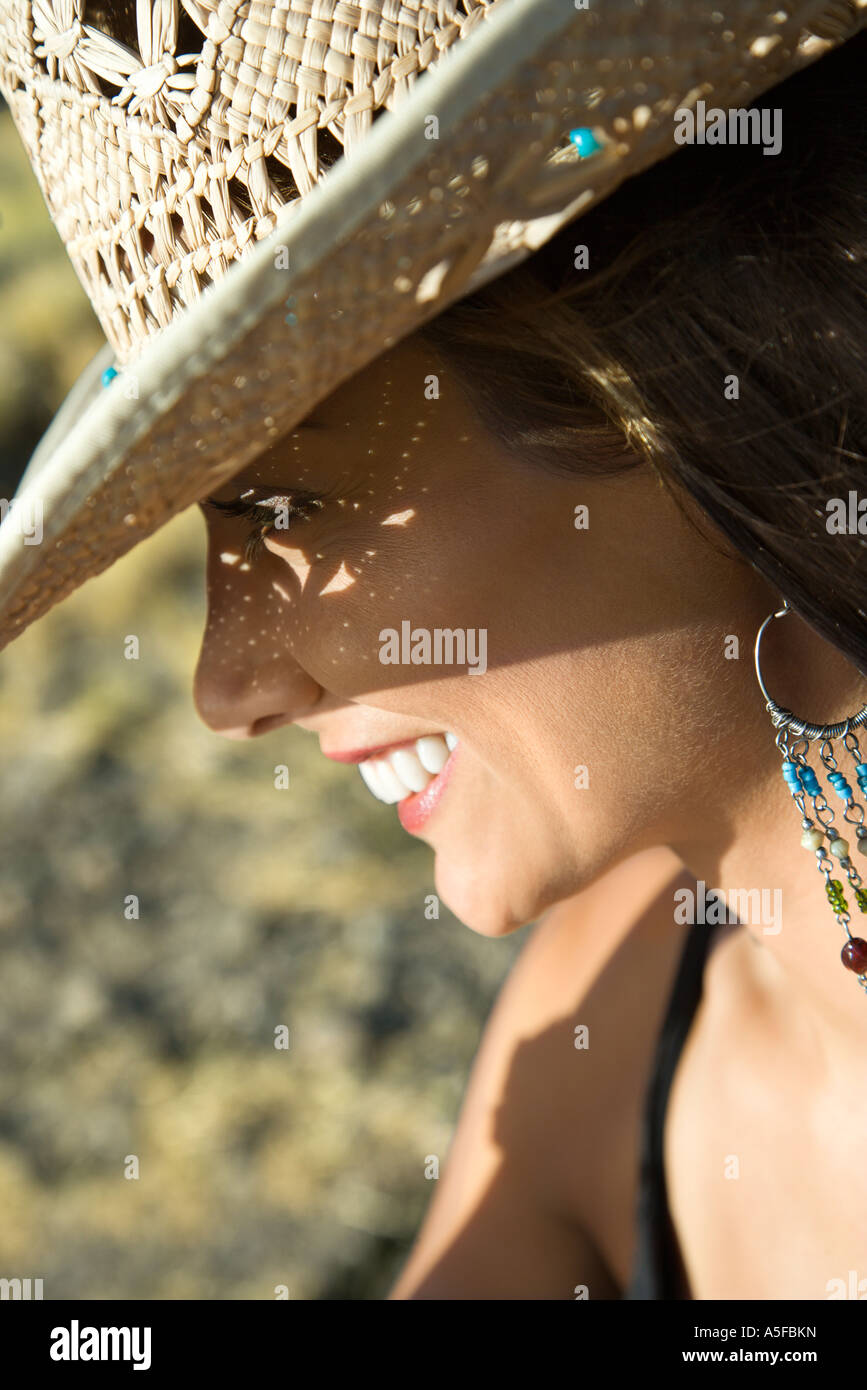 Woman wearing straw hat smiling hi-res stock photography and images - Alamy