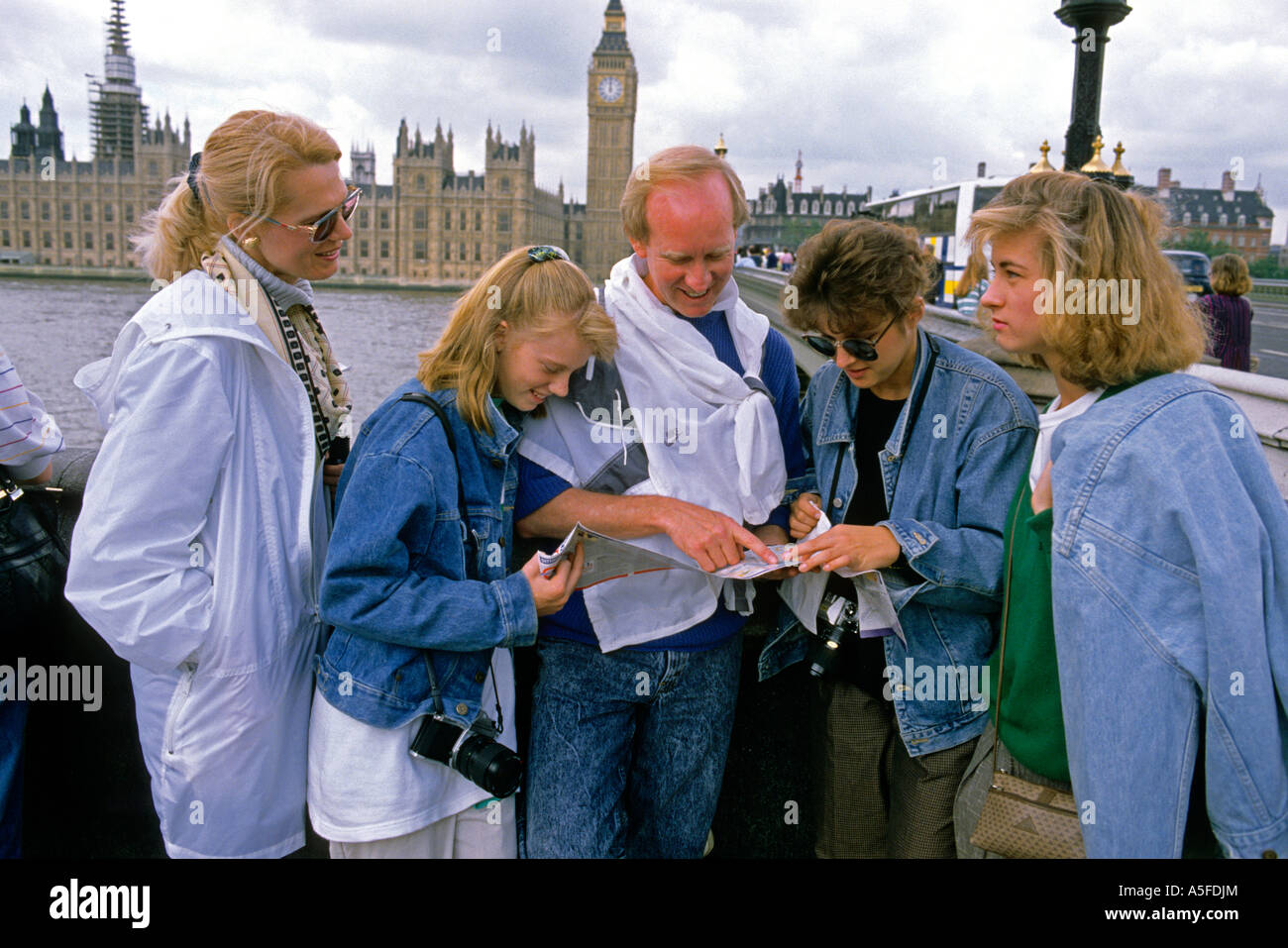 American tourists look at a map in London England Stock Photo