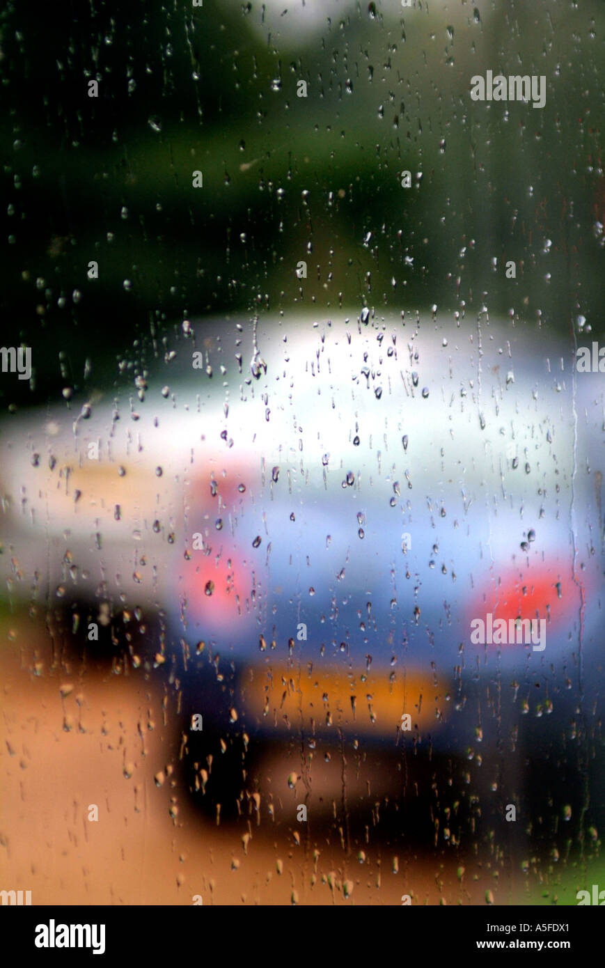 cars through blury rainy window Stock Photo - Alamy