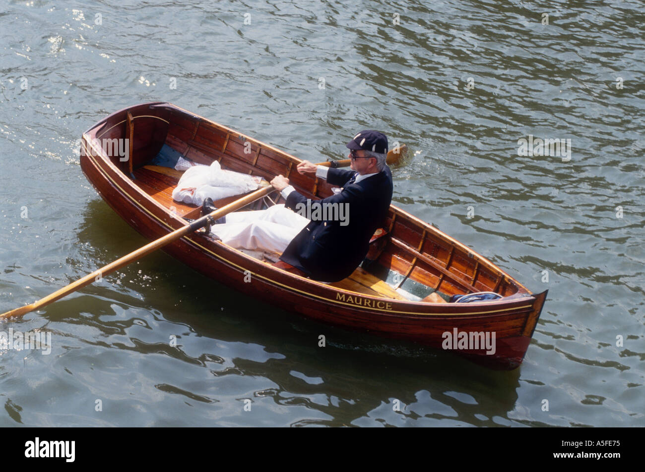 Clinker Rowing Eight A gentleman rowing a clinker dinghy at Henley Royal Regatta on the ...