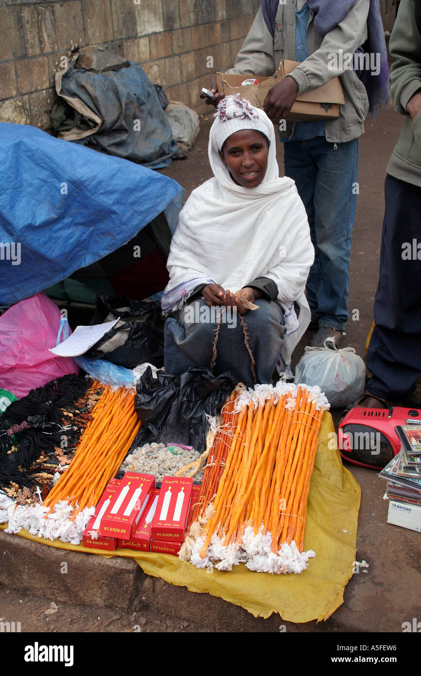 Addis Ababa, Ethiopia, woman selling bee wax candles and other holy