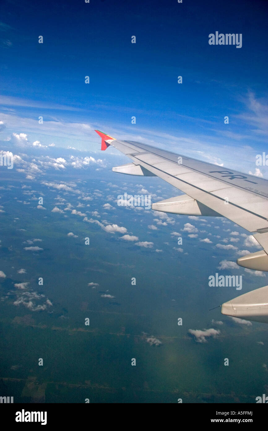 Airplane wing above the clouds Stock Photo - Alamy