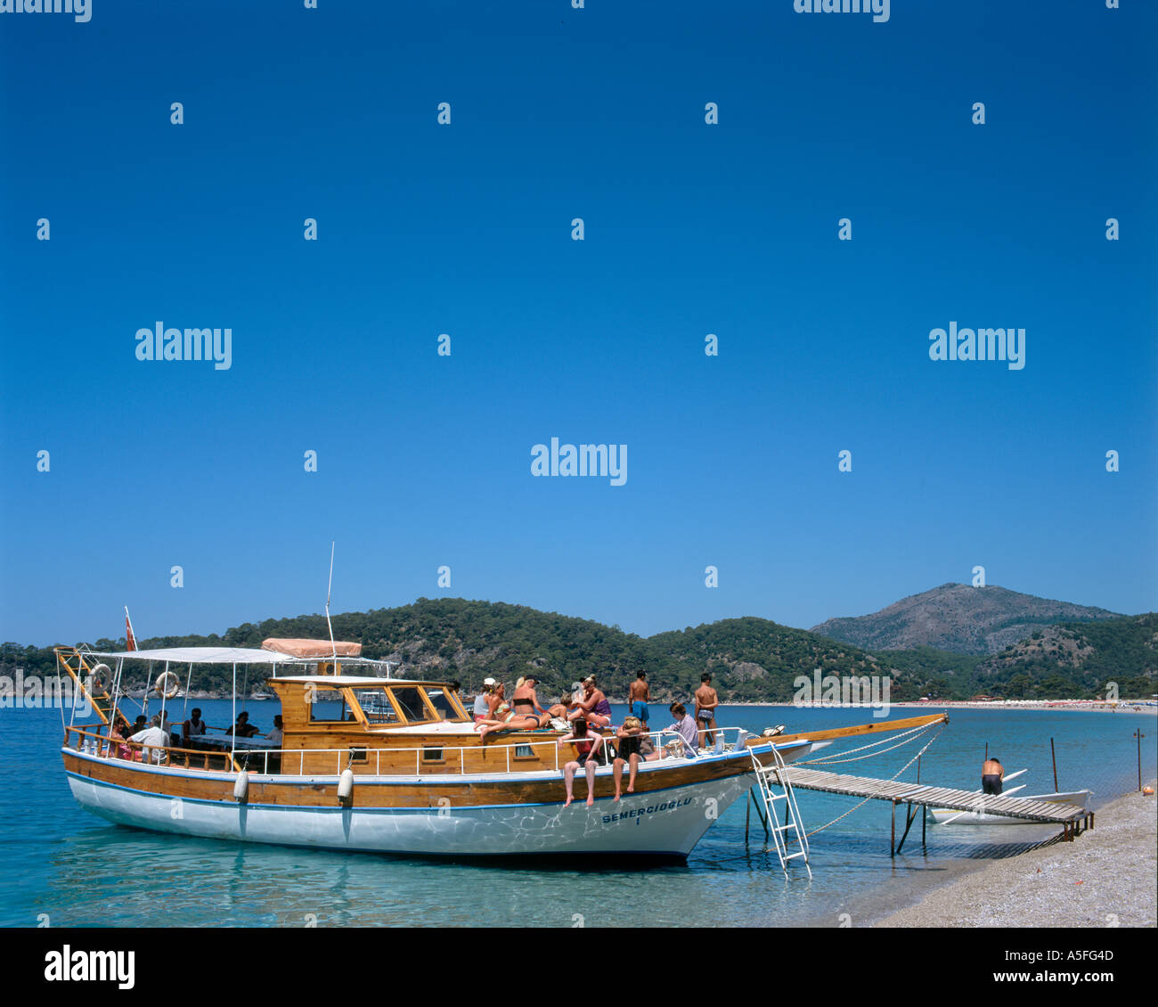 Excursion boat on the beach at Olu Deniz, Fethiye, Turkey Stock Photo