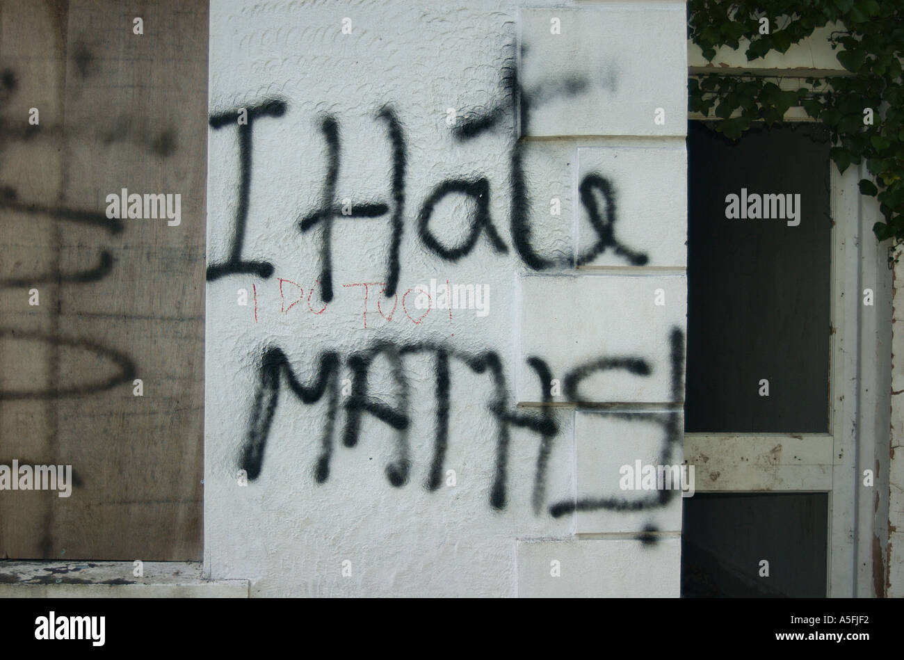 Graffiti saying I Hate Maths on a wall near Coleg Menai Bangor North Wales Stock Photo