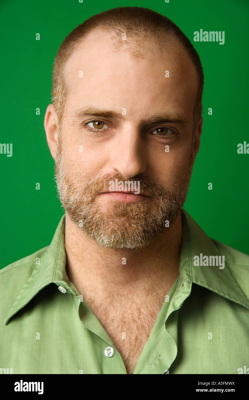 Head and shoulder portrait of Caucasian man with receding hairline and