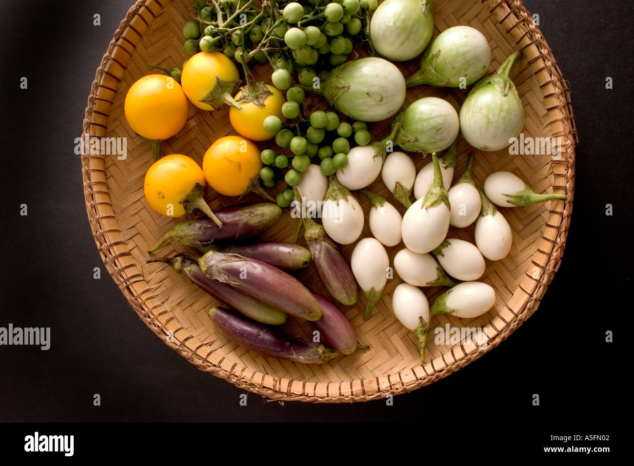Aubergine varieties black background Stock Photo - Alamy