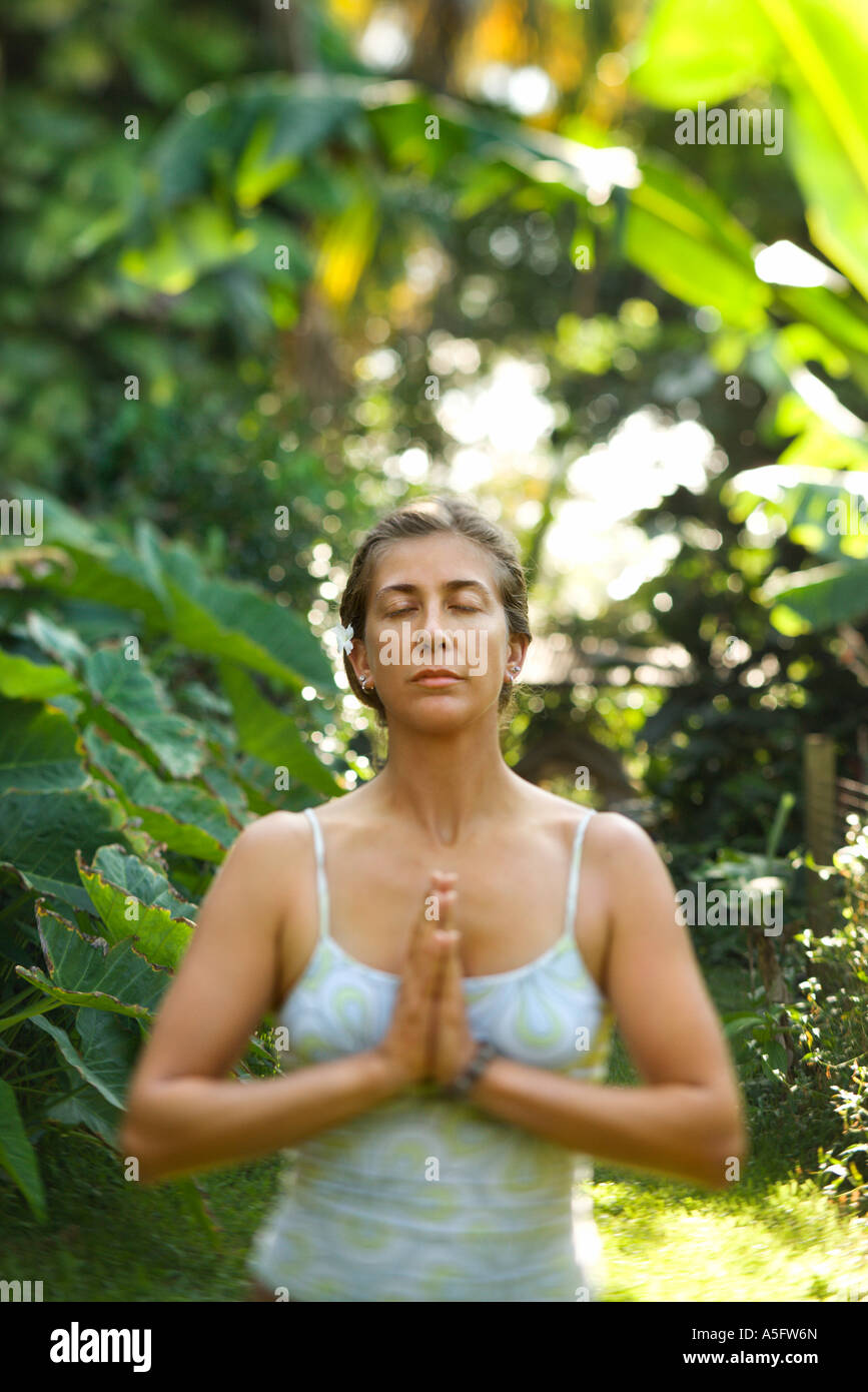 Caucasian mid adult woman meditating Stock Photo - Alamy
