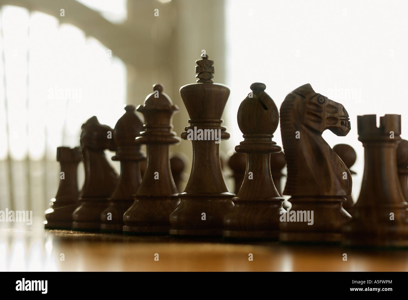 Chess pieces set up on board Stock Photo