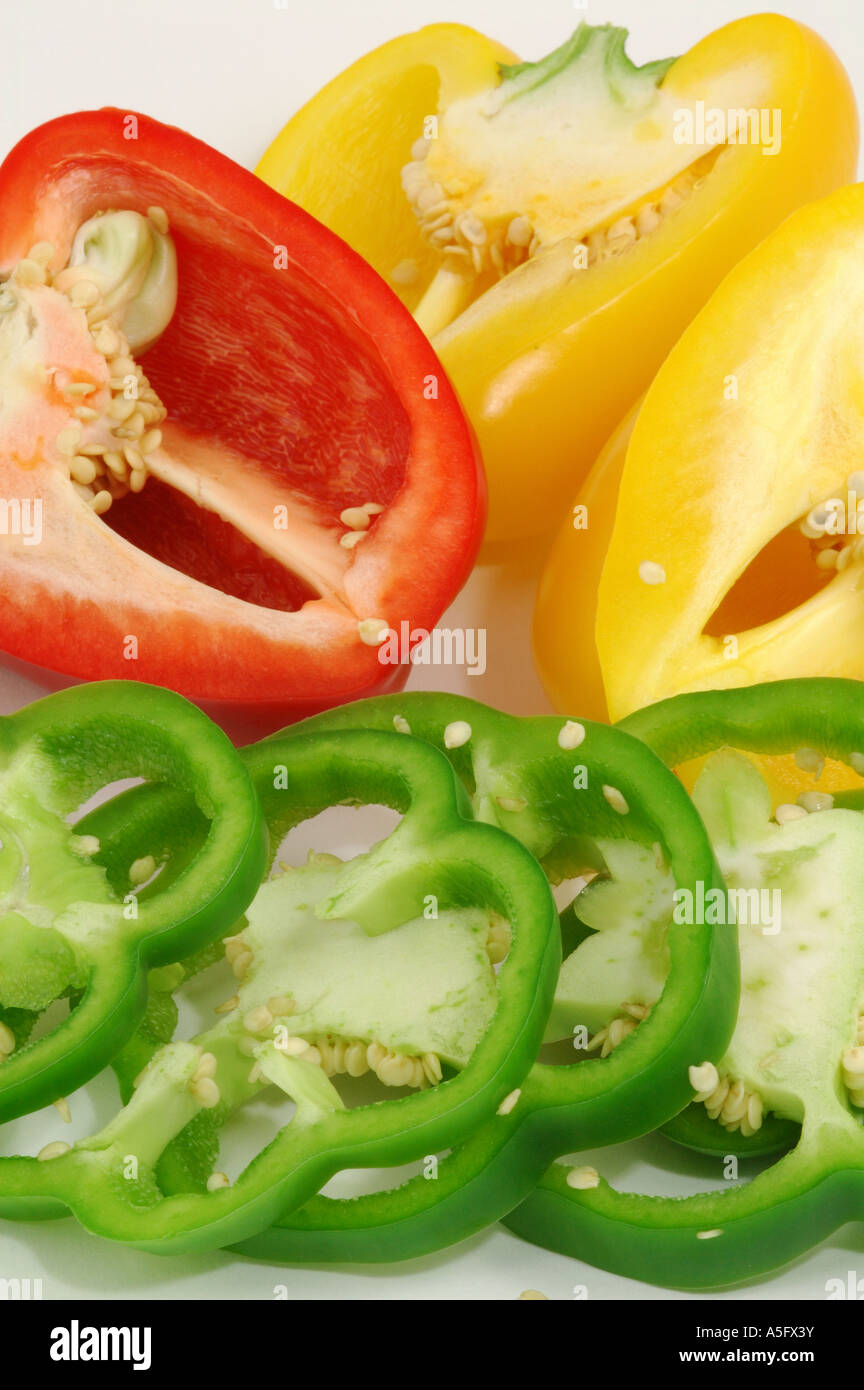 Sliced red yellow and green sweet bell peppers Stock Photo - Alamy