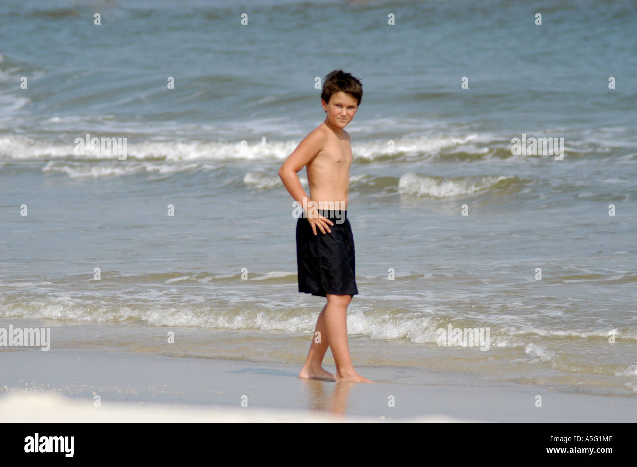 boy modeling at beach