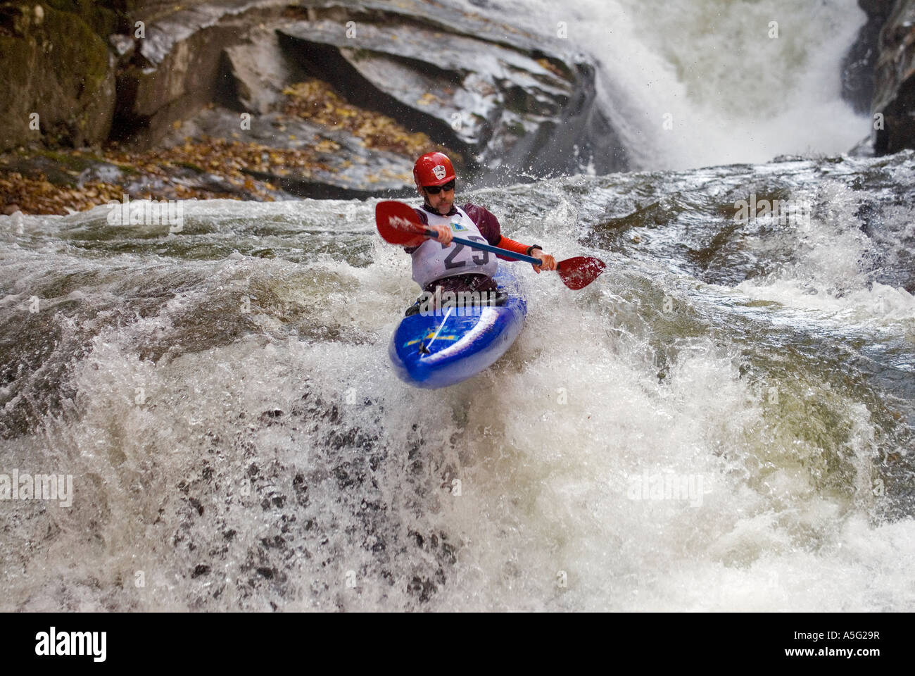 Exreme whitewater kayaker navigates class V five rapids during the