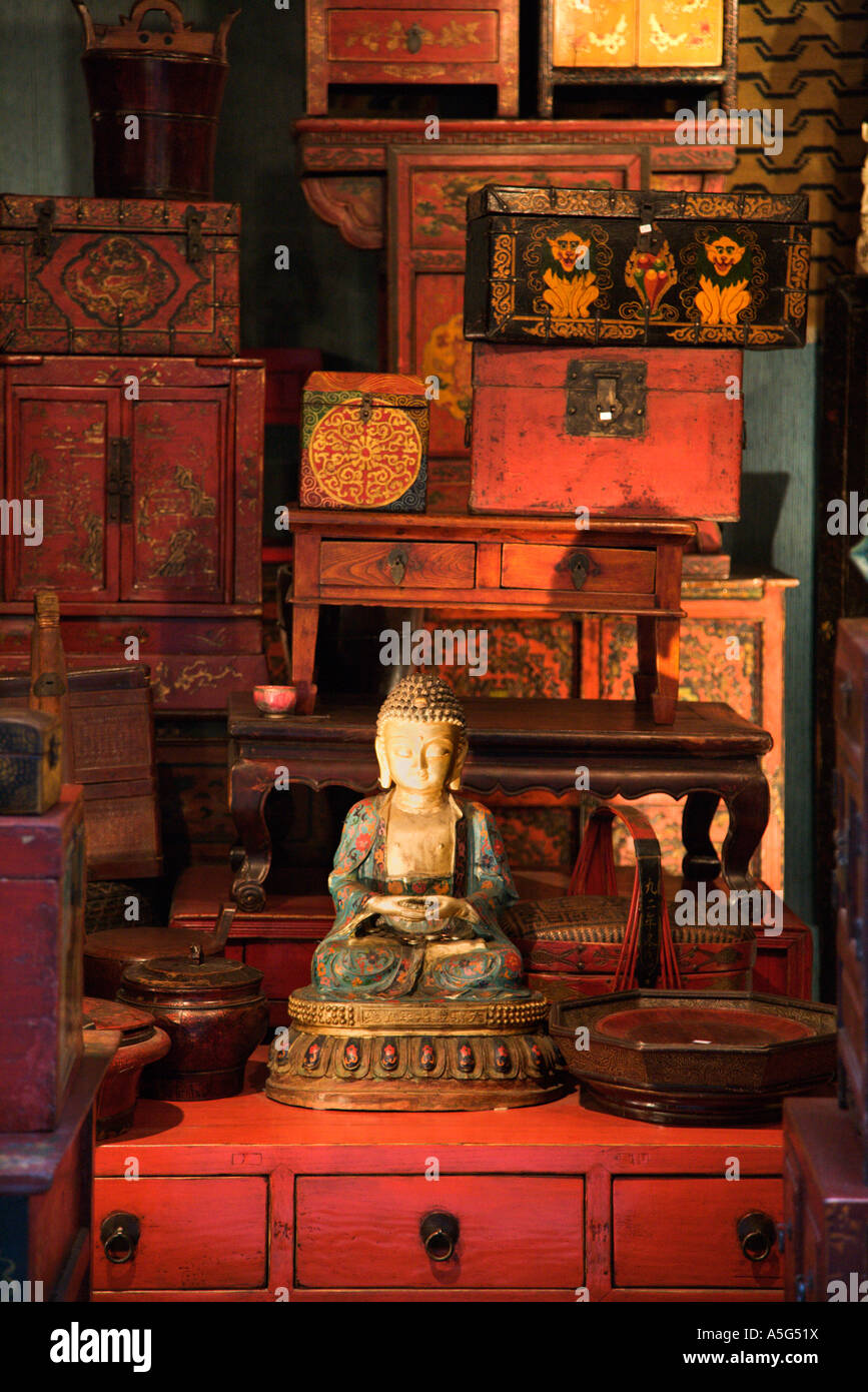 Buddha statue in antique store Stock Photo Alamy