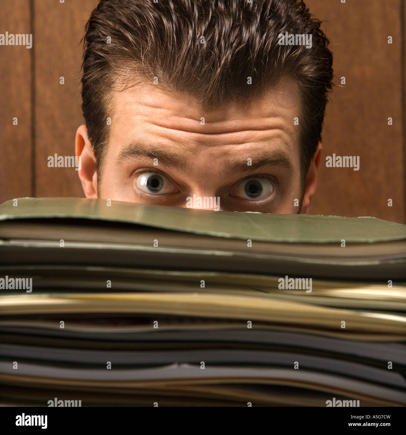 Businessman looking stack folders hi-res stock photography and images ...