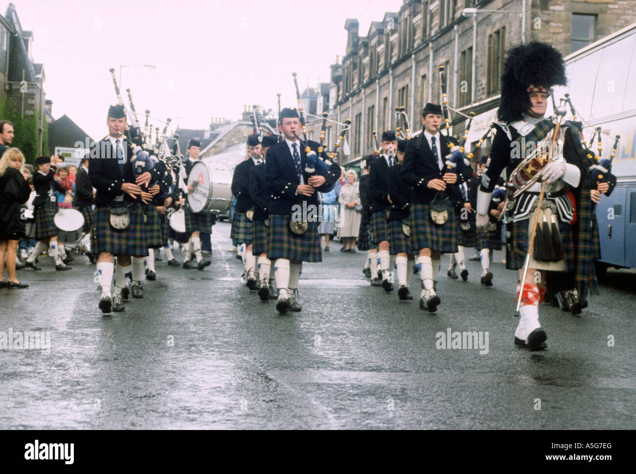 A bagpipe marching band opens the Highland games in Pitlochry, Scotland