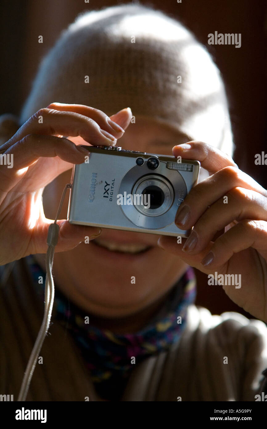 Woman Enjoys Learning to use Her New Digital Camera Stock Photo