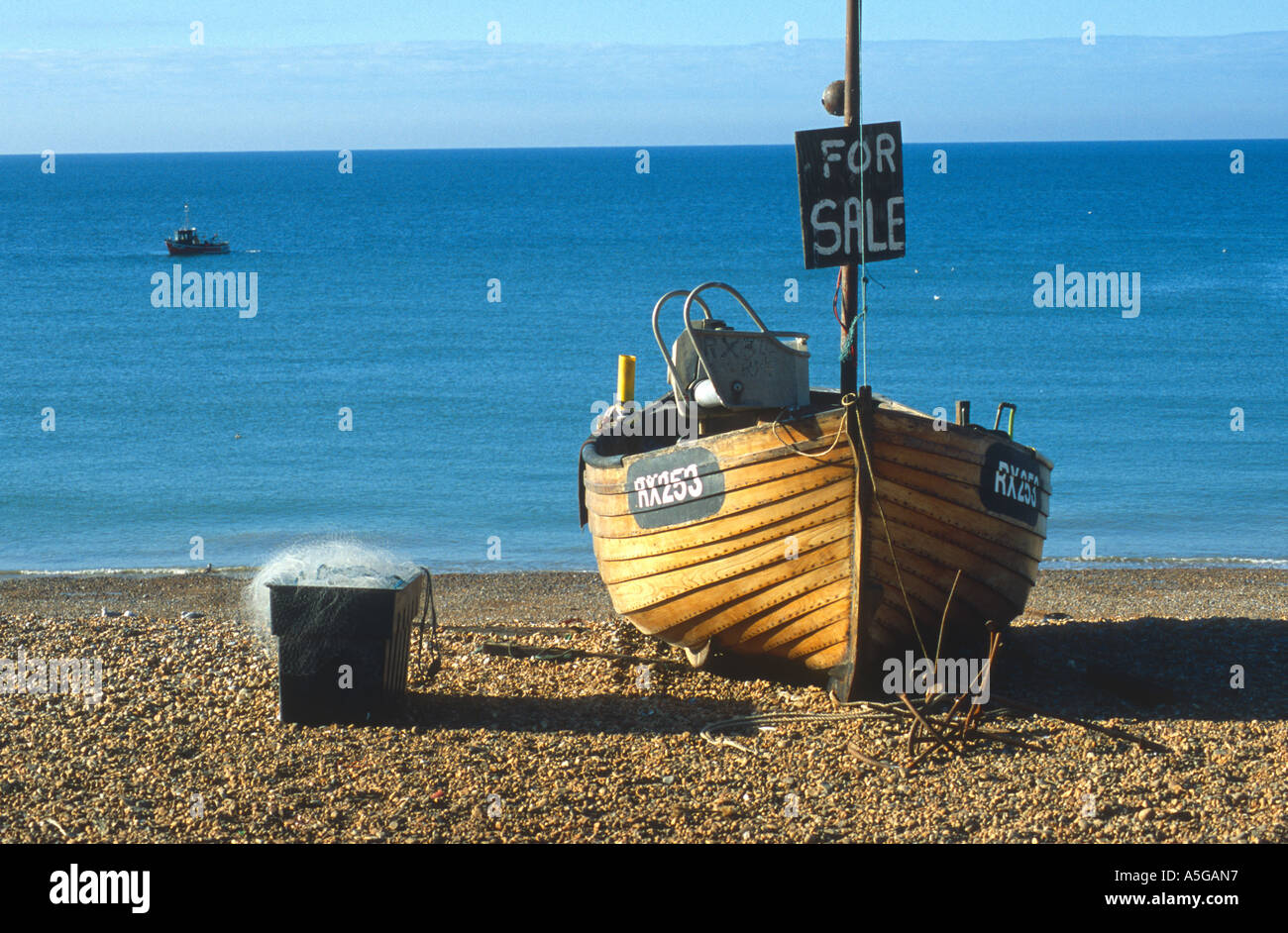 Fishing boat with For Sale sign Rock a Nore beach Hastings East Sussex