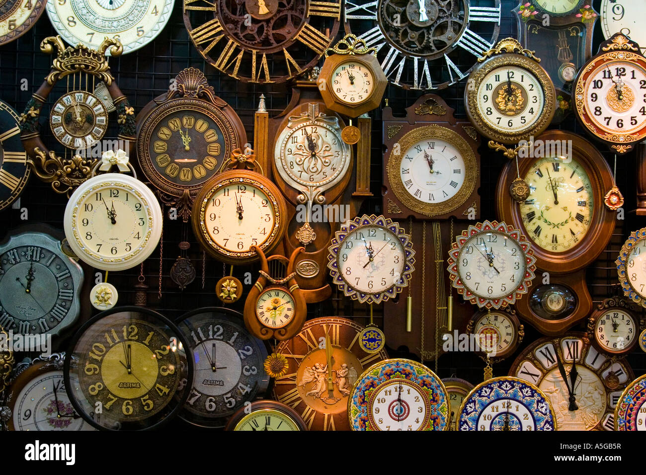 Wall of Clocks in a Store Stock Photo