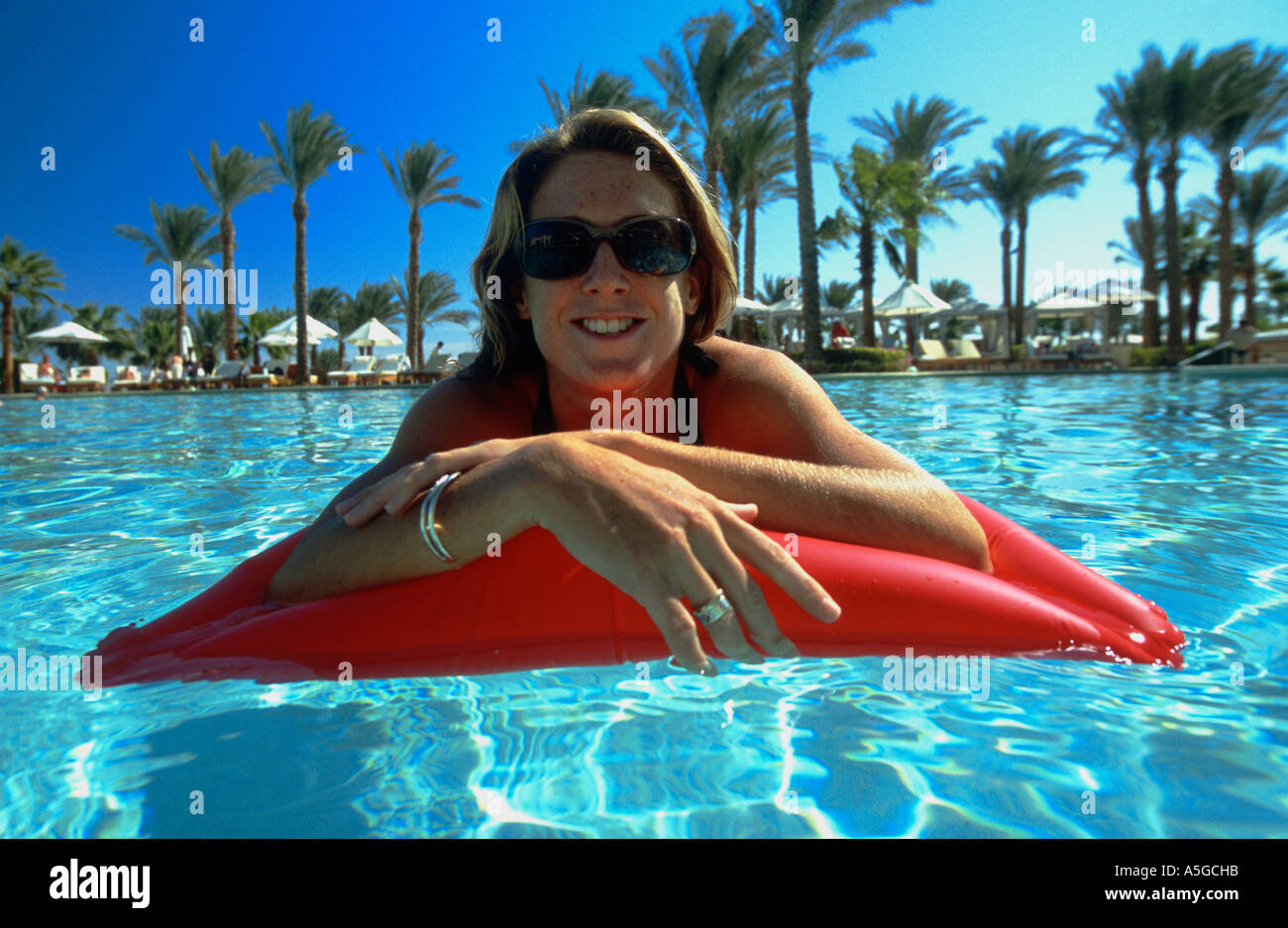 Girl floating on lilo hotel swimming pool Sharm el Sheikh Sinai Red Sea Egypt Stock Photo Alamy